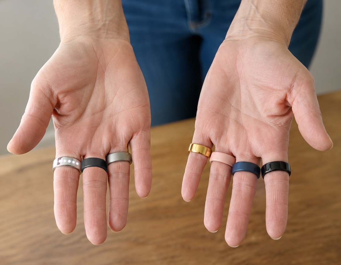 Hands displaying several smart rings